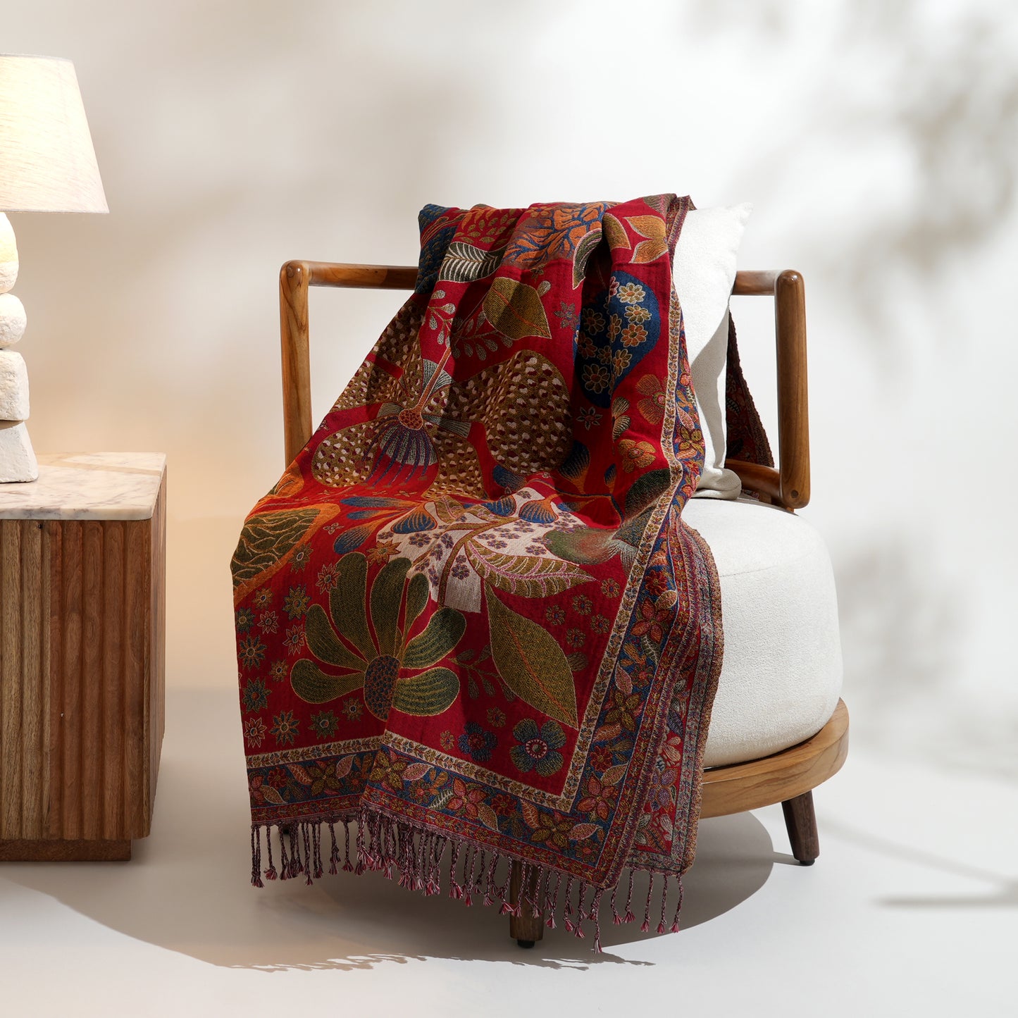 Cotton throws featuring a vibrant red paisley design. Crafted with a luxurious 90% cotton and 10% wool blend, this throw offers exotic opulence and bohemian elegance. Limited stock available, secure yours today. Explore the collection.