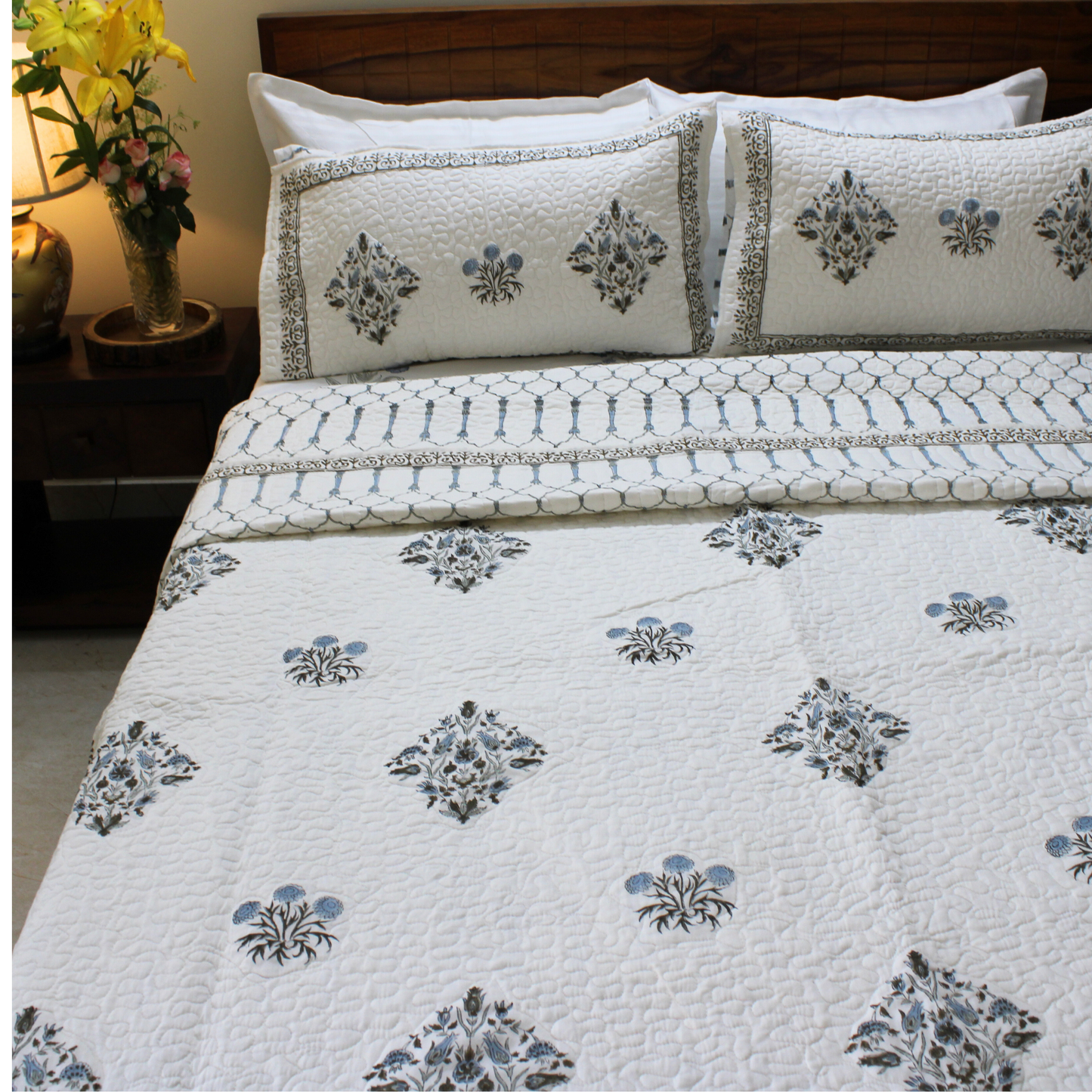 Cotton, hand block printed, pure cotton layer, quilted with precision, artisanal craftsmanship, luxurious comfort, unique design.