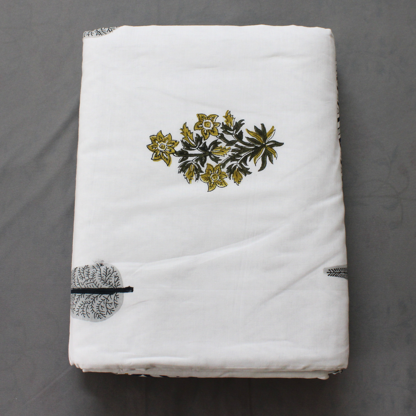 Shop at earthandoaks.com for premium cotton muslin white color dohars blankets, hand block printing of Flowers and Geometrical shape inspired from nature and heritage motifs, lightweight and incredibly soft. Bring heritage back to your home. Dimensions: Single 65"x 95", Machine wash on gentle cycle with mild detergent, tumble dry low.