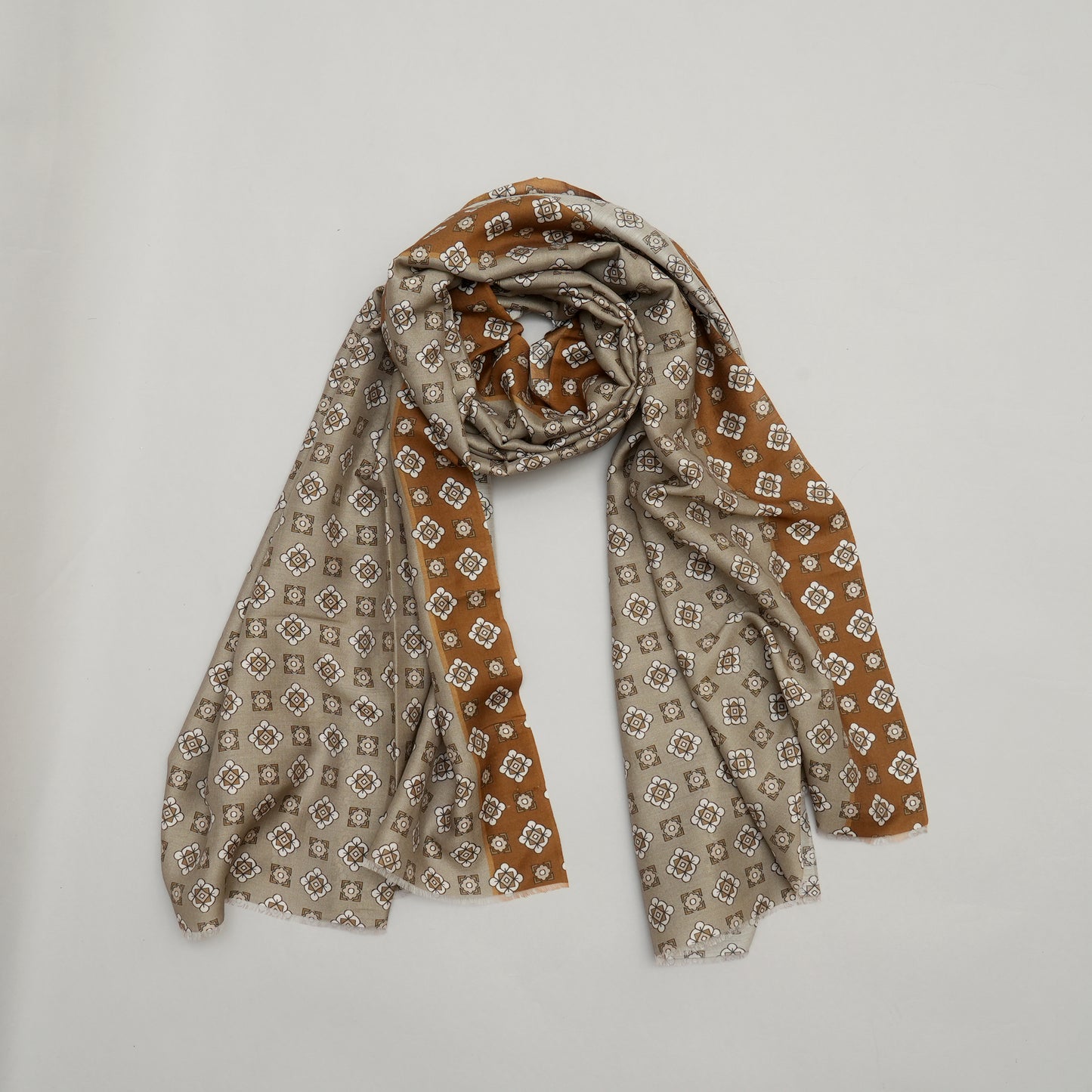Patterned scarf in brown and beige on a light gray background The Urban Luminary-Modal Silk Stole
