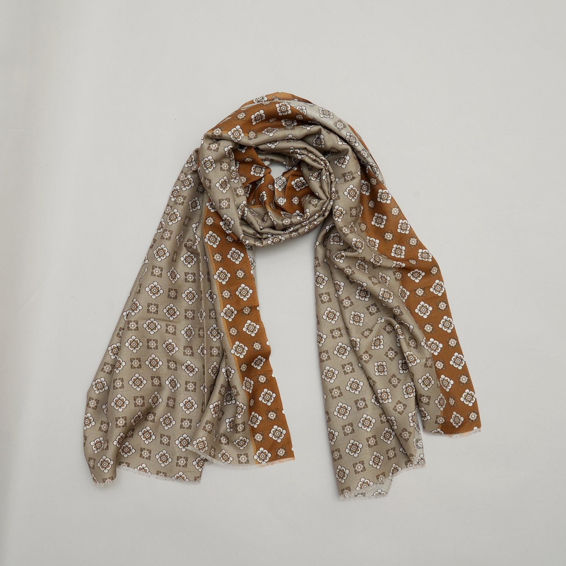 Patterned scarf in brown and beige on a light gray background The Urban Luminary-Modal Silk Stole
